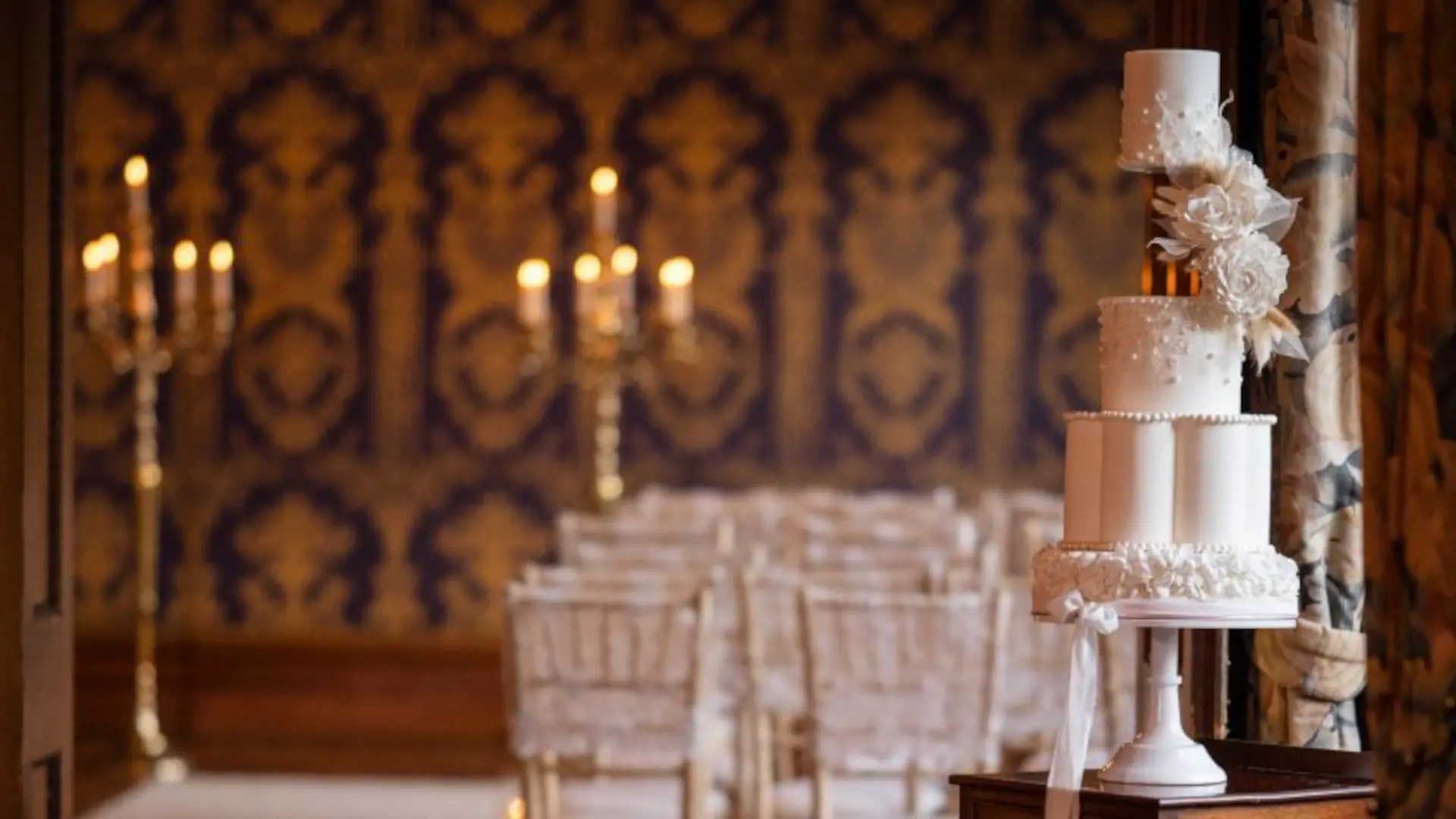 A traditional tiered white wedding cake, one of the many different styles of wedding cakes designed and baked by Mel's Amazing Cakes. Credit to Stacey Oliver Photography.